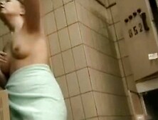 A brunette gets completely naked in this changing room spy cam video