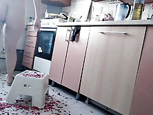 Sexy nude woman preparing food in the kitchen.  Hairy brunette hair,  big ass,  big breasts.