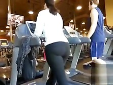 Fat ass woman walks on the treadmill