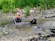 Arousing Mud Romp Naked With Glasses