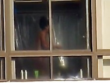 Black spied throughout her apartment window
