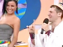 Raven-haired bombshell's jugs bust out of her shirt as she is dancing