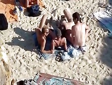 4 Guys Playing On Nude Beach