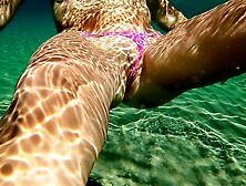 Hot Milf in Microthong shows her cunt underwater