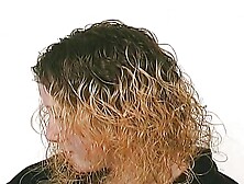 A slim blonde girl slave enjoys getting warm wax all over the body