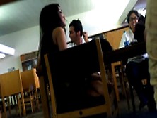 Beautiful Indian girl in sexy tight jeans touching her lovely naked feet in public