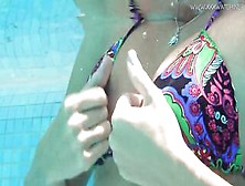 Mary Kalisy rubs her clitoris and snatch lips and swims