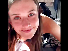 Teen in short skirt and stockings sits between my feet and blows my dick in POV