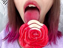Slutty stepsister swallows a lollipop and show her long attractive hot tongue