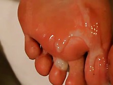 Dirty feet getting cleaned with cum