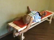 Blonde girl bound to bench