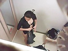Naughty video of a black haired beauty in the changing room