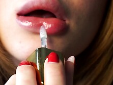 Close Up Of Sensual Babe Putting Lipstick On Her Sexy Lips