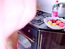 Older sexually excited woman has sex in the kitchen with her stepson during the time that her spouse is watching TV