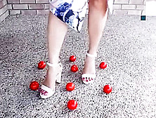 Tomato crushed and destroyed under White heels