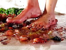Crushing grapes,  crackers,  and peppers barefoot