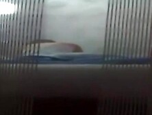 Voyeur Peeping Through Window with MILF undressing on SpyAmateur. com