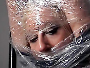 Pretty girl wrapped in plastic
