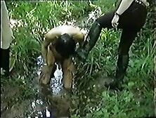 licking boots in mud