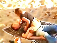 tapes a young couple having sex at the beach
