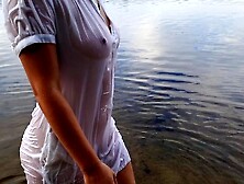 Tender lady. Nymph walks in a wet transparent shirt