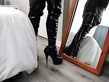 Showing off thigh high boots and corset
