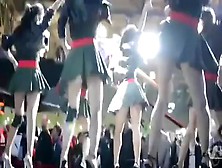 Short pleated skirts and heels on sexy dancing girls