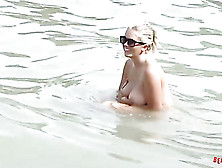 Big tits come out at a public beach