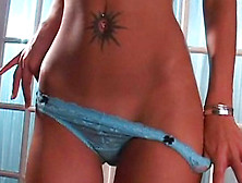 Tanned babe Jasmine Melatti takes off her sexy clothes