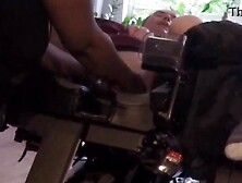 Old movie scene of disabled man being helped