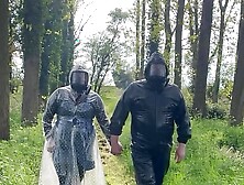 Plastic raincoat and gasmask in the woods