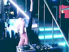 Nude DJ playing music with her boobs bouncing