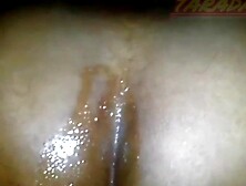 Ebony woman sitting with her tail