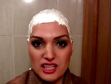 Cute girl headshave with cream and razor