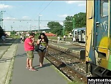 Judy Carmell is outdoors walking along the railroad tracks