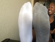 Smiley ebony girl got her attractive teenage feet in white socks filmed