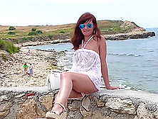 Sensual Brunette Wears A See-Through Dress To The Beach