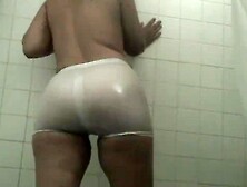 White spandex shorts and white t shirt in the shower transparent