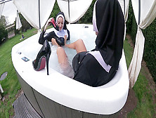 Two Mischievous Nuns Get Wet In The Hot Tub