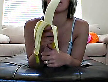Teasing teen peels banana