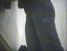 A girl in the swimming pool dressing cabin gets naked and displays her tits