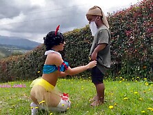 Laura Jones as Snow White steals milk from a careless dwarf