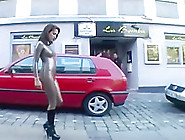 Girl has to walk in latex catsuit on the street because she lost a bet