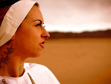 Slutty nun Ivizia Dakini shows off her gorgeous body in the desert