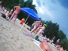 A voracious loves making videos on the nude beach.