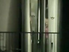 Peeping through hotel bedroom window