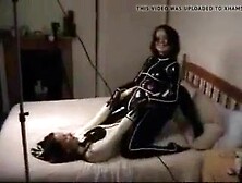 Cute teens making out in latex catsuits