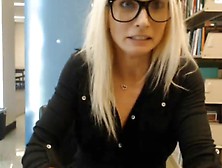 Cute blonde college girl flashing in the library