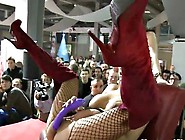 Busty blonde dildos herself on stage