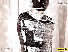 Fejira Com Full Body Wrapped In Tight Latex Clothing And Plastic Wrap